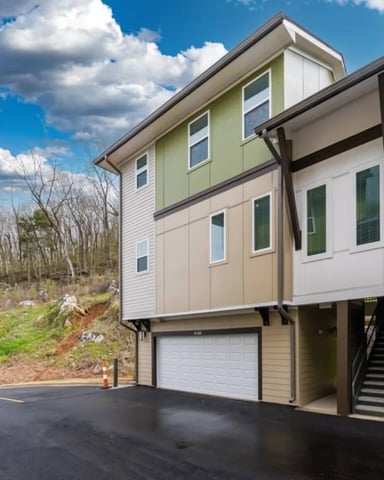 Pelham townhome exterior with a private garage
