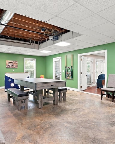 Game room with a pool table and putting green at Fairways Abound