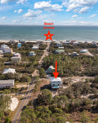 Aerial view showing the Fort Morgan beach house and its Gulf beach access three blocks away